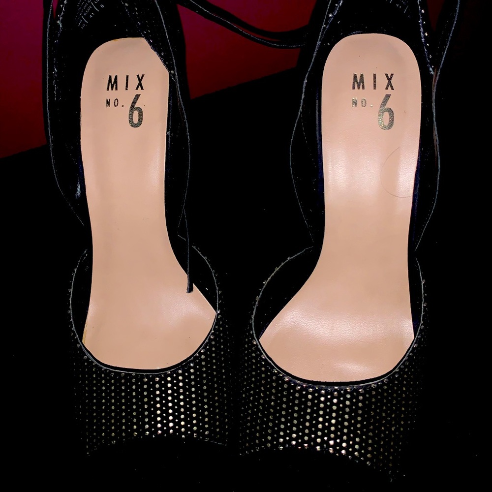 Black open toe heel with gold embellishments.